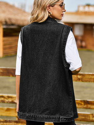 Sleeveless dark gray denim utility vest with button detail at hem