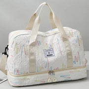 Textured Oxford duffel bag in off-white with colorful wave pattern and dual handles.