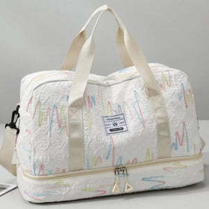 Textured Oxford duffel bag in off-white with colorful wave pattern and dual handles.