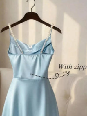 Light blue cowl neck maxi dress with pearl straps and zipper detail.