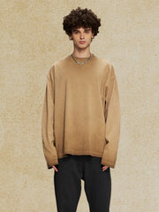 Oversized camel washed cotton long sleeve t-shirt with distressed hem.
