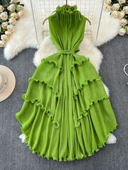 Lime green ruffled tiered midi dress with belted waist and frill neckline.