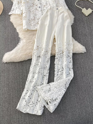 White lace two-piece set with button-up collared top and wide-leg pants with lace trim.