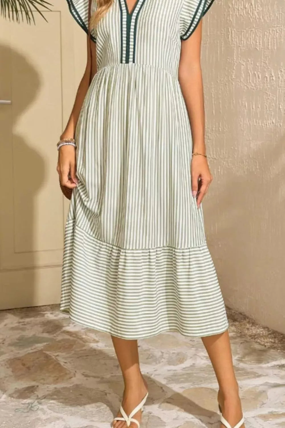 Moss striped midi dress with ruffle sleeves and V-neck, featuring a tiered hem.