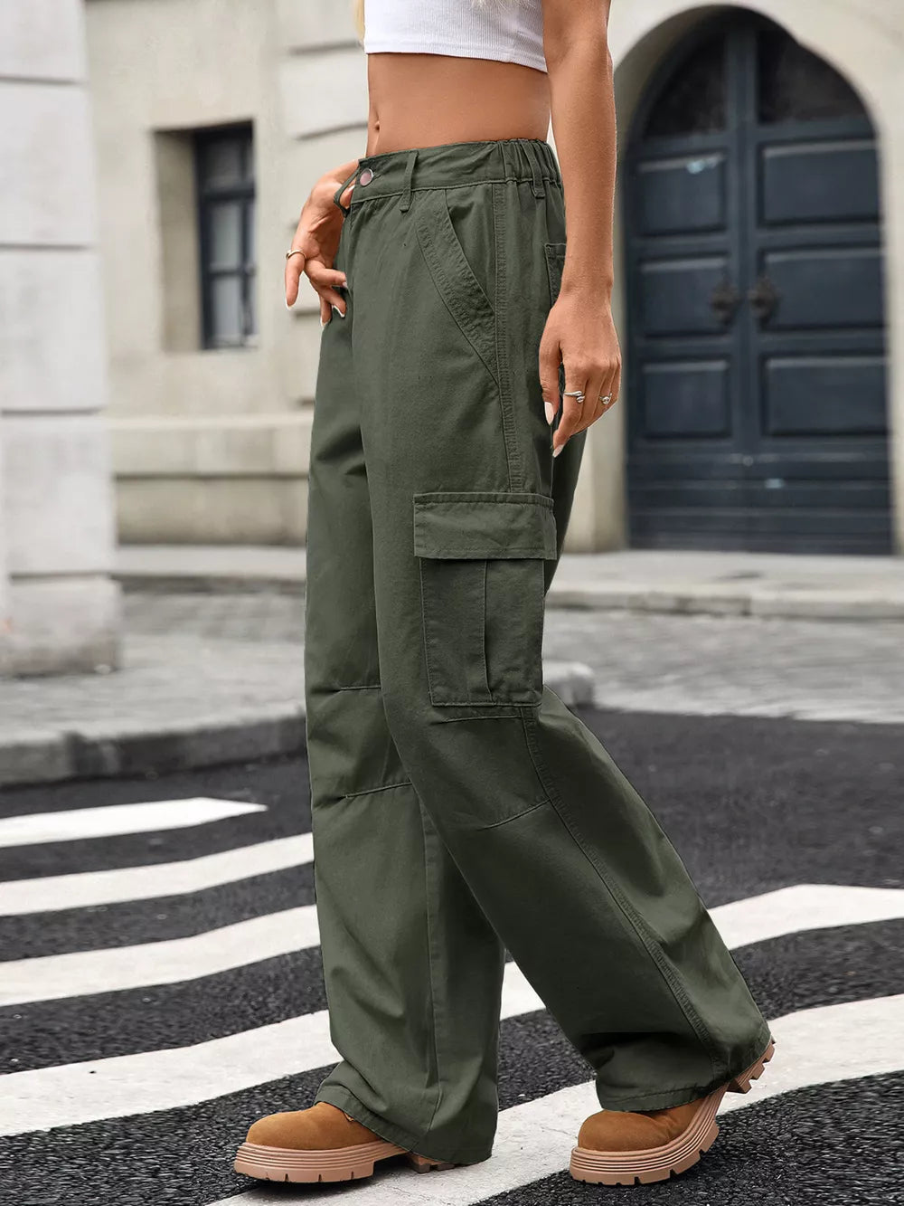 Army green high-waisted cargo jeans with multiple pockets and a relaxed fit.