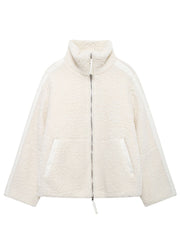 White teddy fleece zip-up jacket with contrast piping and high collar.