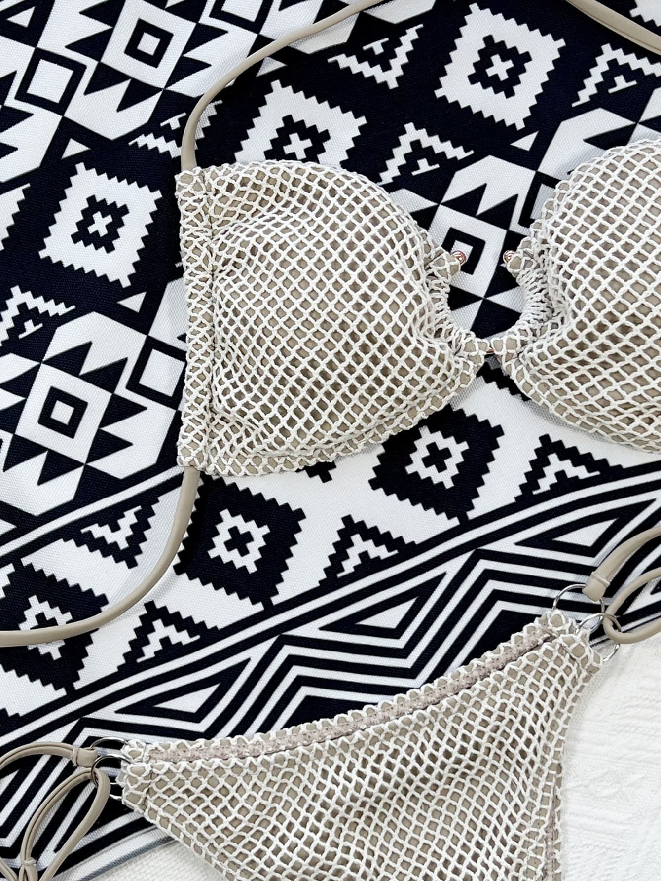 Crochet halter bikini set in ivory with a textured net overlay and neutral straps.