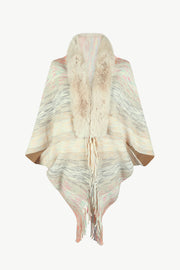 Textured knit cape with faux fur collar and fringe detail in a multi-color stripe pattern.