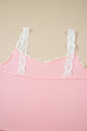 Pink ribbed cami pajama top with white lace trim straps and neckline.