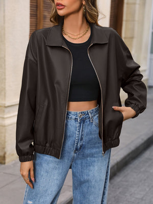 Earthy faux leather bomber jacket in chocolate with zip front and elastic cuffs.