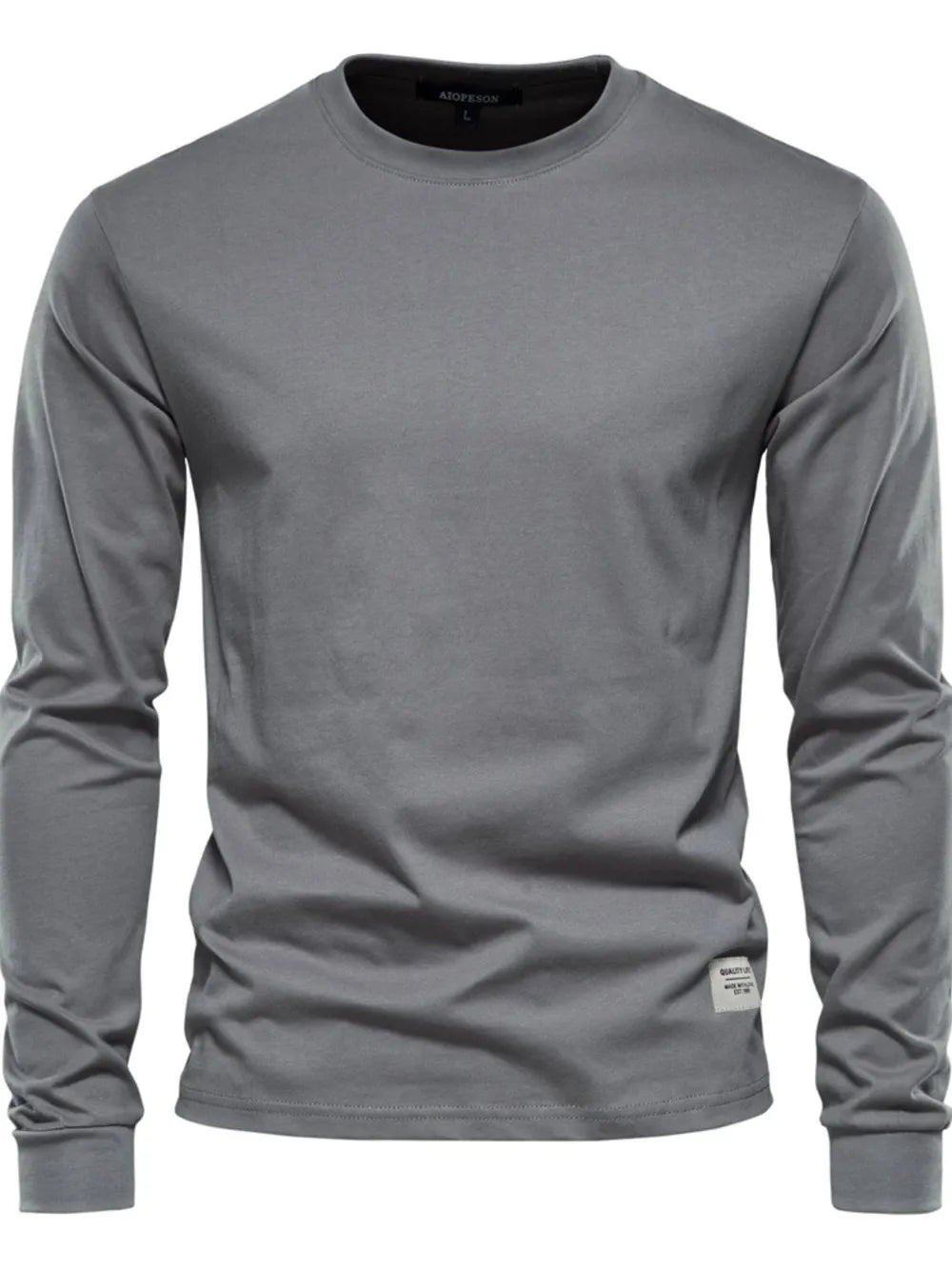 Gray crewneck long sleeve t-shirt with a small woven label detail on the hem.