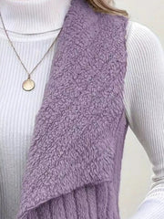 Purple fleece vest with open front, textured material, styled with a white turtleneck and necklace.