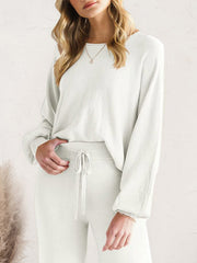 Ivory wide-leg knit loungewear set with crew neck sweater and drawstring pants