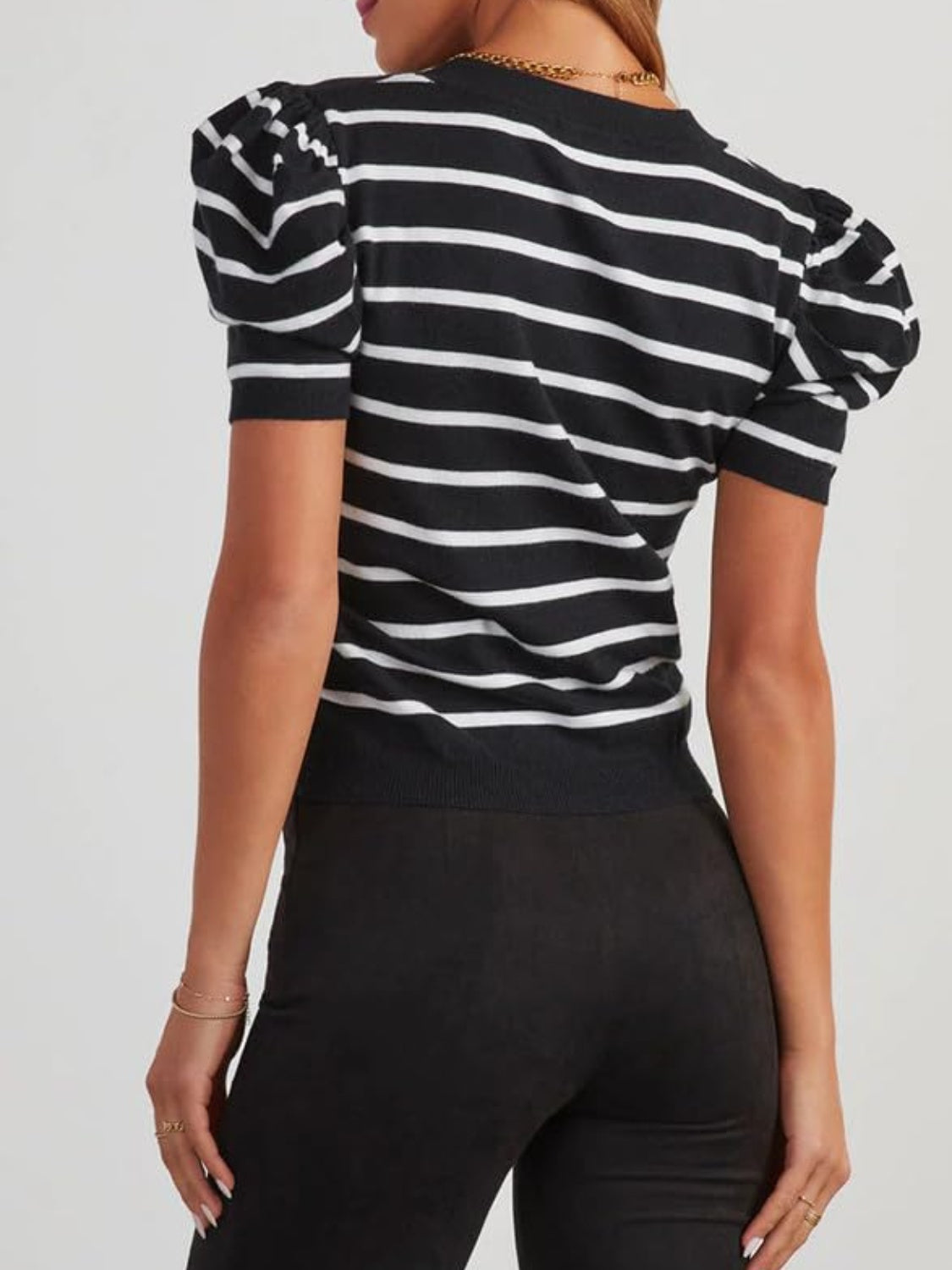 Black and white striped knit sweater with puff sleeves.