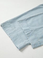 Light blue striped cotton blend drawstring jeans with a mid-rise cut.