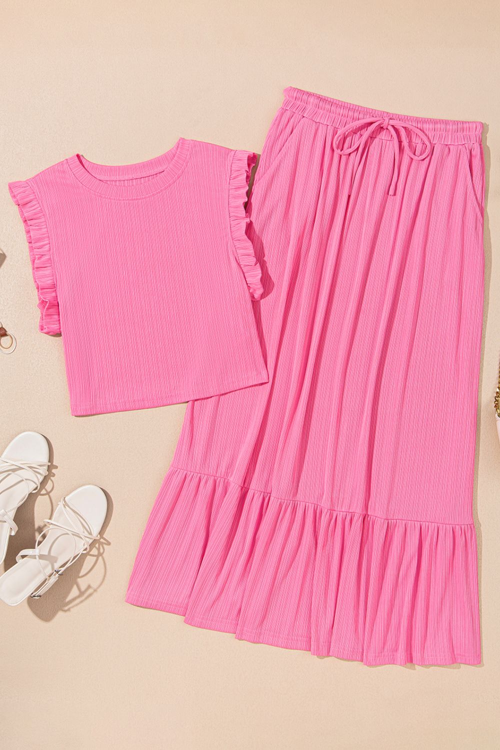 Pink ribbed co-ord skirt set with ruffled sleeves and tiered hem skirt with drawstring waist