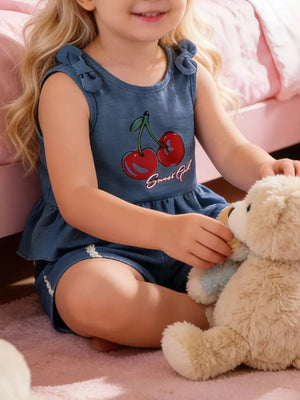 Denim peplum tank with cherry graphic and bow shoulder straps, paired with shorts.