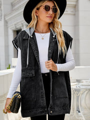 Dark denim utility vest with hood and pockets, open front, worn by a woman.