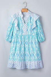 Blue patchwork ruffle mini dress with balloon sleeves and a tiered hem.