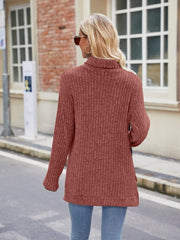 Ribbed turtleneck sweater in Brick Red with side slits and long sleeves.