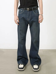 Flared dark wash denim jeans with subtle fading and bootcut leg