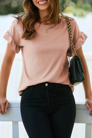 Pink ribbed maternity t-shirt with ruffled short sleeves and relaxed fit.