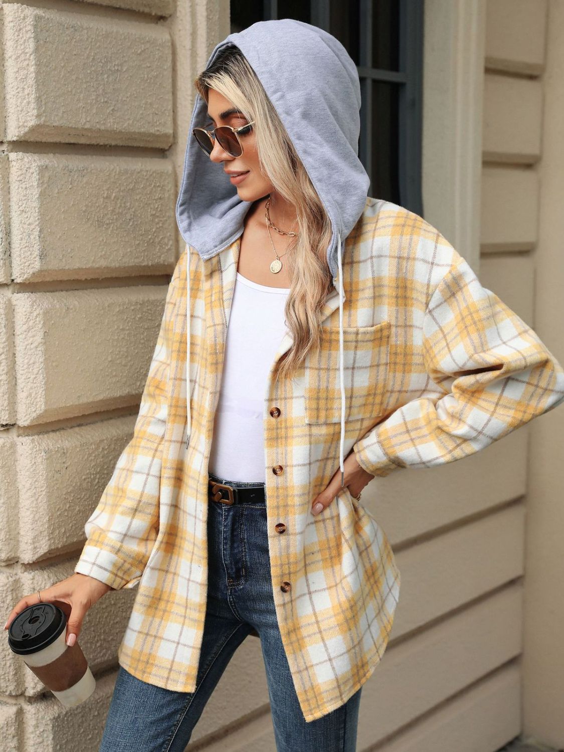 Pastel yellow plaid shacket with grey contrast hood and button front.