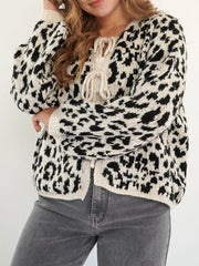 Leopard print tie-front cardigan with cream accents and balloon sleeves.