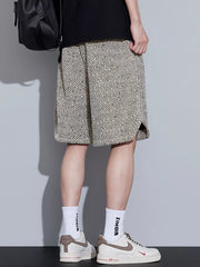 Men's boxer shorts with a black and beige abstract stripe pattern and adjustable drawstring.