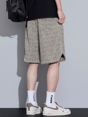 Men's boxer shorts with a black and beige abstract stripe pattern and adjustable drawstring.