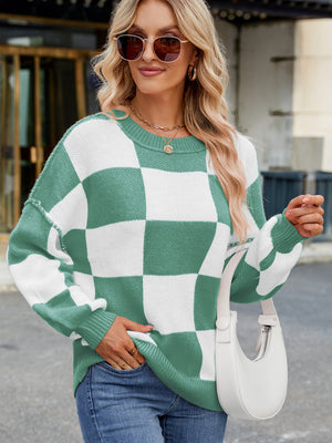 Checkerboard knit sweater in Gum Leaf green and white with balloon sleeves and crew neck.