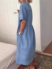 Denim midi dress with short sleeves, button front, and pockets.