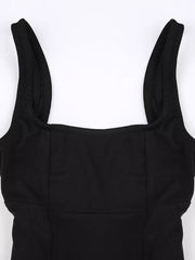 Black backless mini dress with square neckline and wide straps.