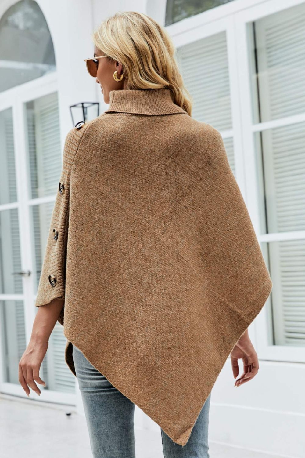 Caramel knit poncho with turtleneck and button details on sleeve