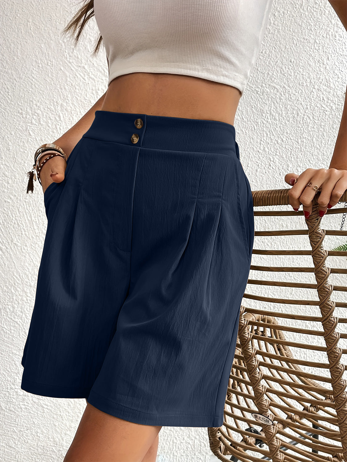 Dark Blue pleated front bermuda shorts with a button closure and pockets.