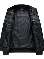 Black leather moto jacket interior with smooth lining and a pocket detail.