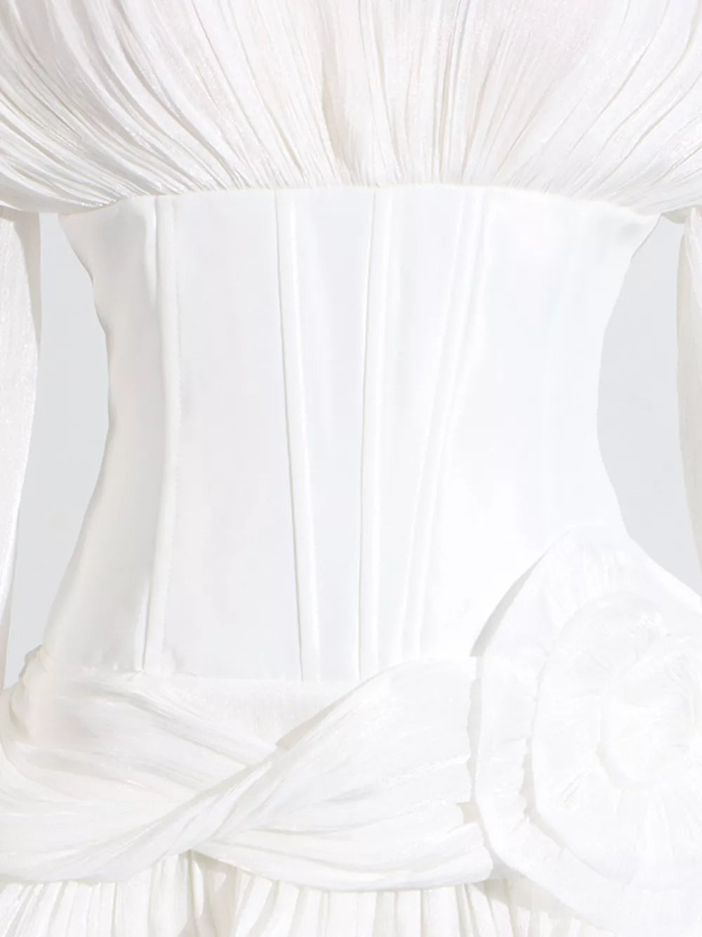 White ruffle mini dress with balloon sleeves, corset bodice, and floral detail.