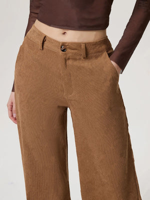 Camel corduroy wide-leg trousers with button closure and front pockets.
