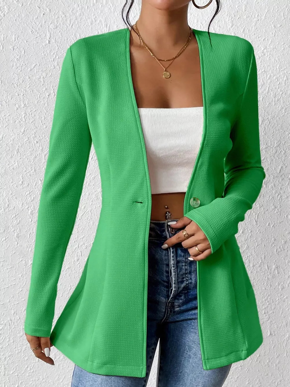 Green single-button blazer with tailored fit and textured fabric, open front.