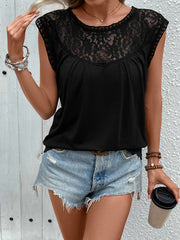 Black cap sleeve blouse with lace yoke detail and round neckline.