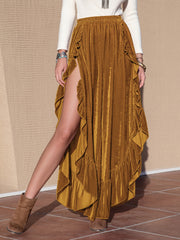 Velvet ruffle slit palazzo pants in caramel, showing a high slit and flowing fabric.