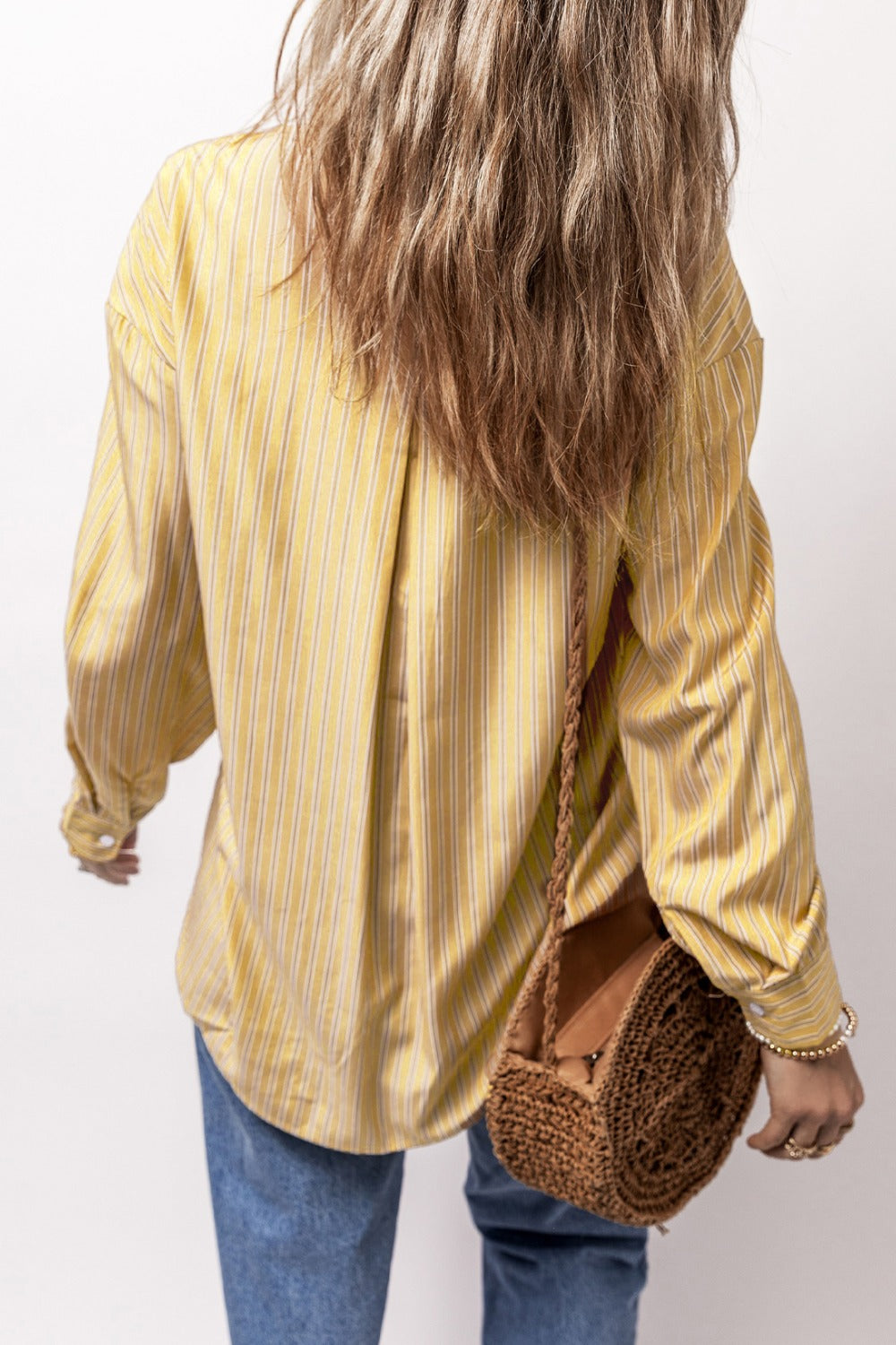 Oversized yellow striped Oxford shirt with buttoned cuffs and a relaxed fit.