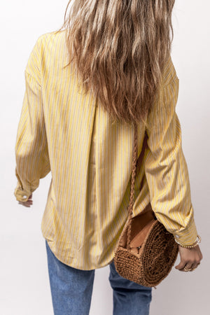 Oversized yellow striped Oxford shirt with buttoned cuffs and a relaxed fit.