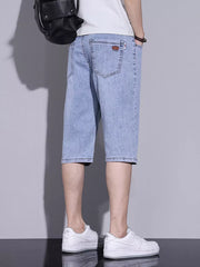 Men's light blue washed denim shorts with classic fit and button closure.