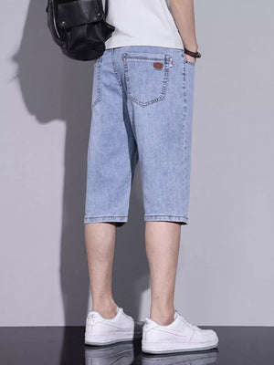 Men's light blue washed denim shorts with classic fit and button closure.