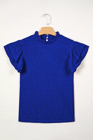 Blue textured short sleeve shirt with ruffle trim and mock neck.