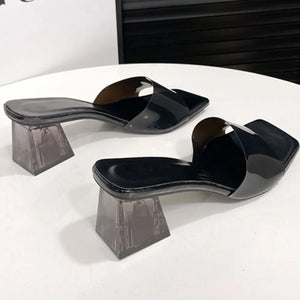 Black square toe mules with clear block heels