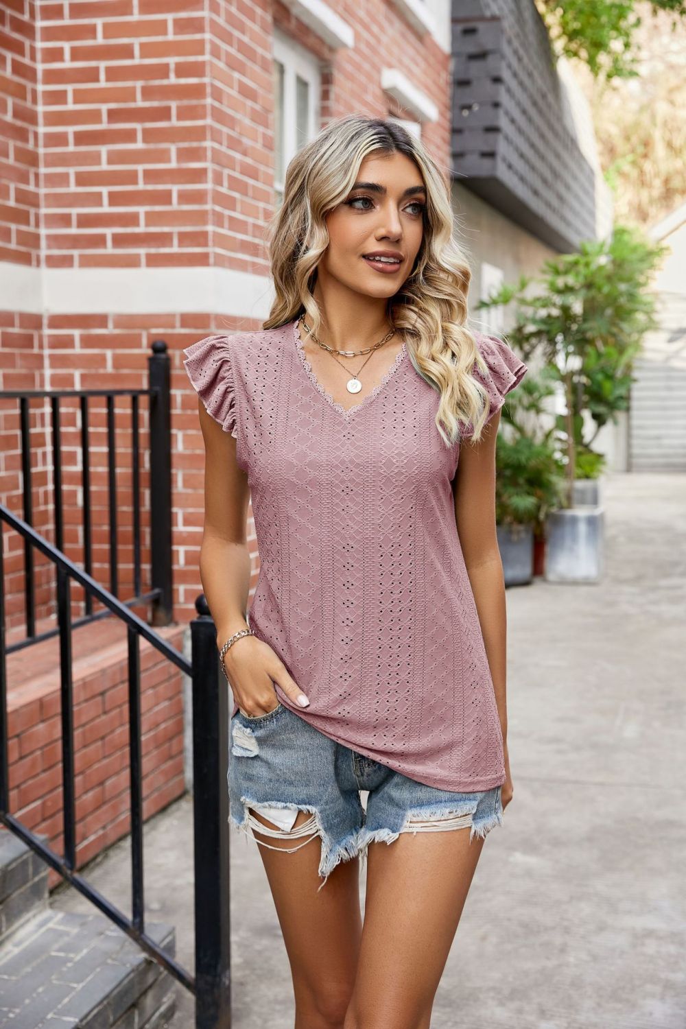 Blush pink lace trimmed flutter sleeve blouse with eyelet detail