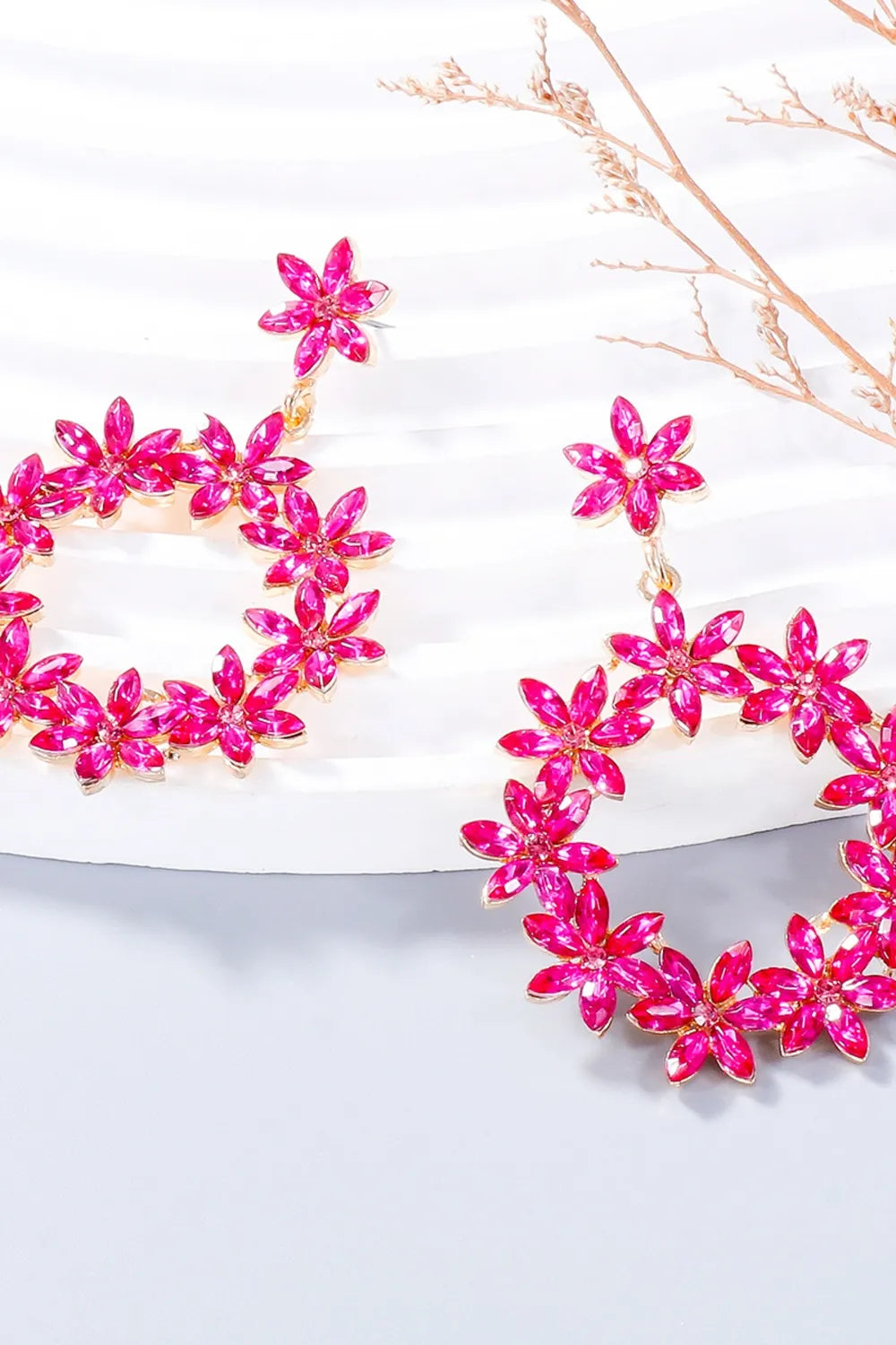 Hot Pink floral halo drop earrings with crystal flower details.