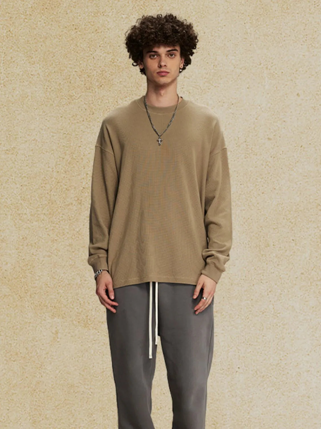 Oversized drop shoulder crewneck sweatshirt in khaki with crew neckline and long sleeves.